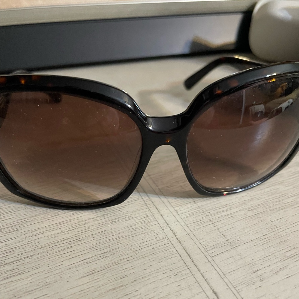 Oleg Cassini sunglasses.